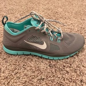 Grey and blue Nike free runs