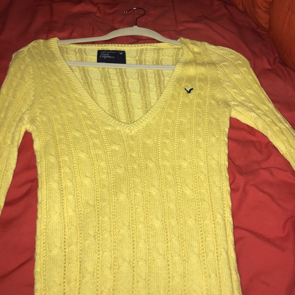 Long yellow knitted sweater