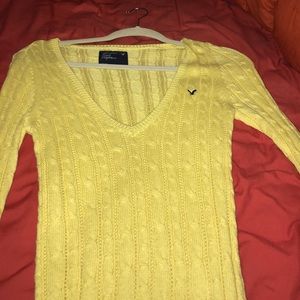 Long yellow knitted sweater