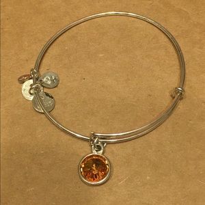 Like new Alex and Ani Topaz stone bracelet