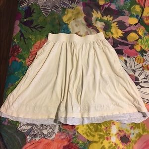 Gap circle skirt, cream colored, low thigh length.