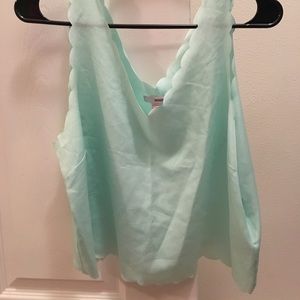 A light blue tank top/crop top