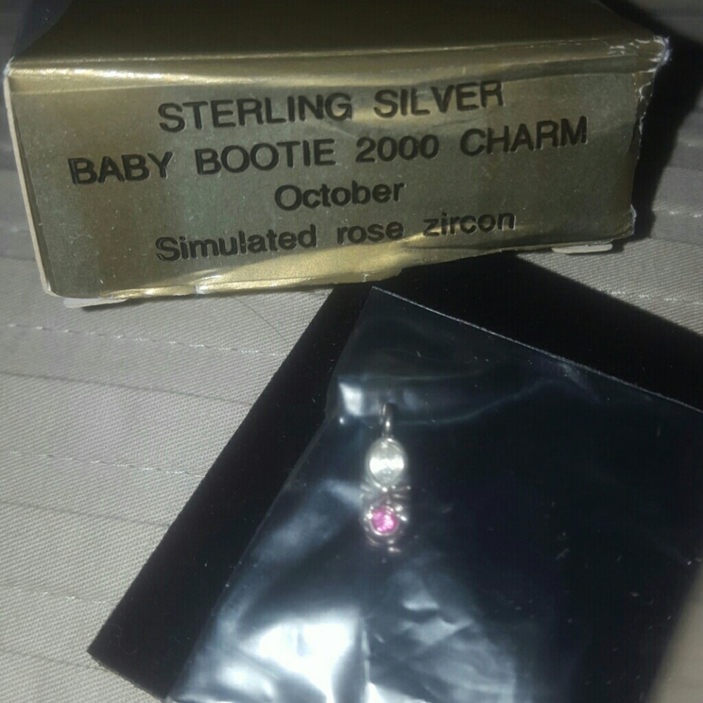Avon October baby bootie charm.  Sterling Silver