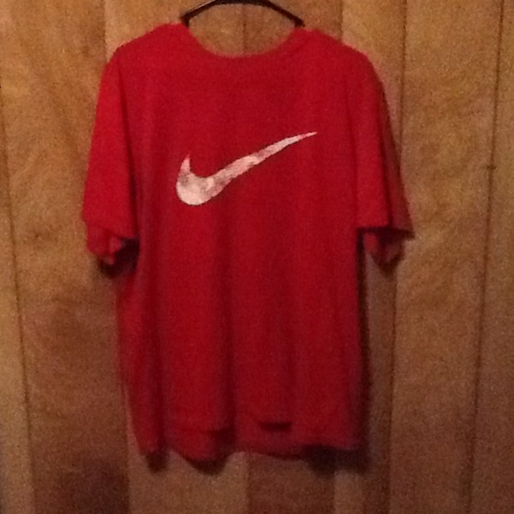 Red Nike dri-fit shirt.