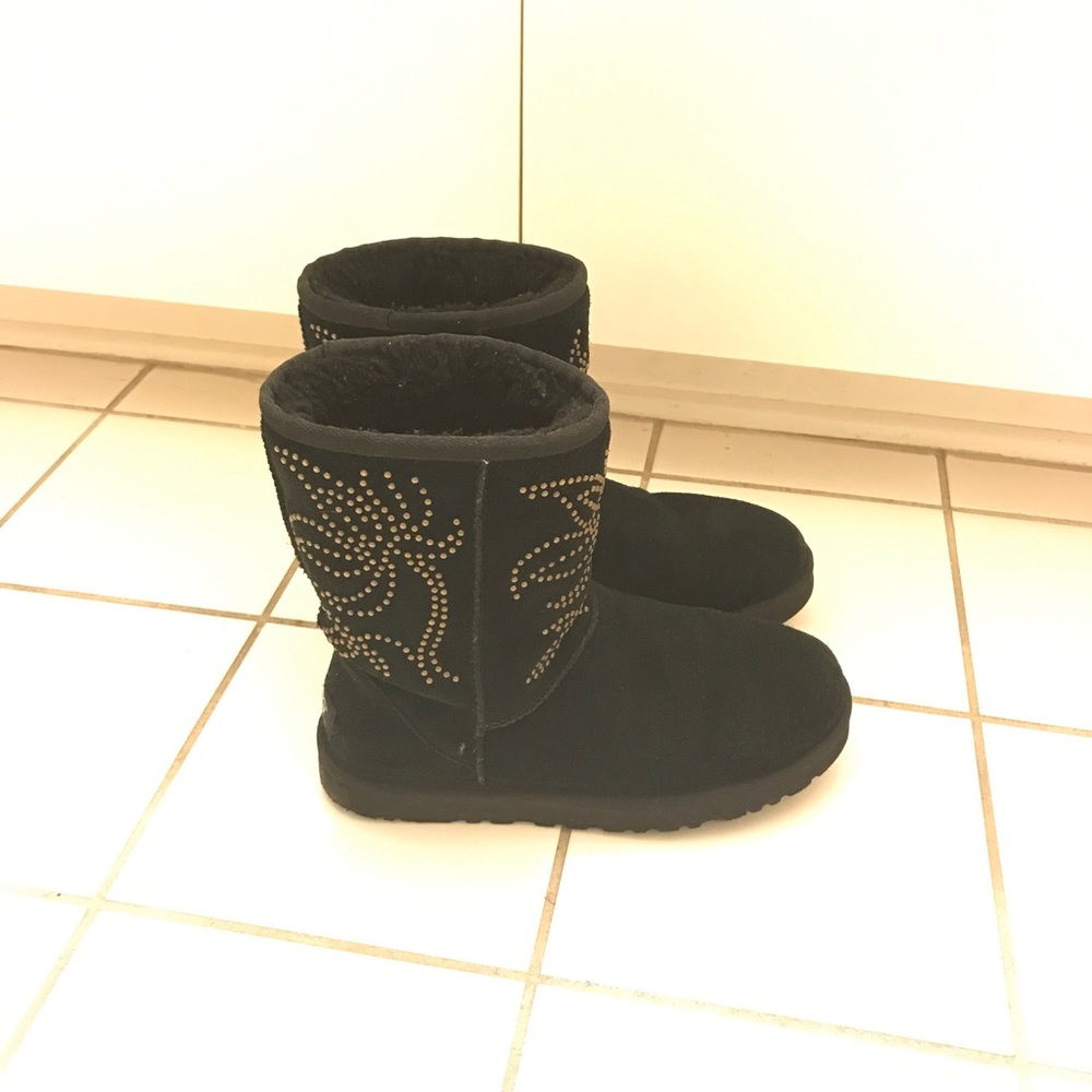 Black Ugg boots short with gold accent studs.