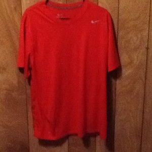 Red Nike shirt.