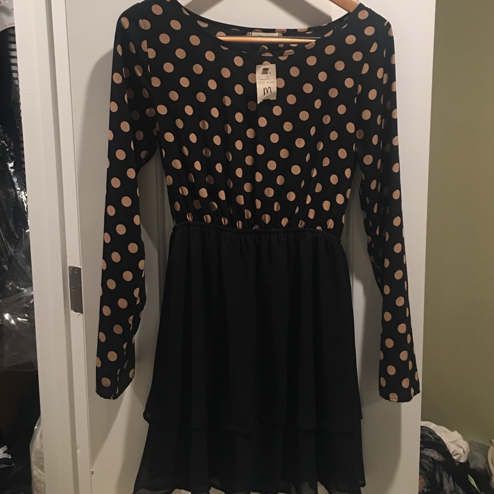 Polka dot dress with easily fixable tear