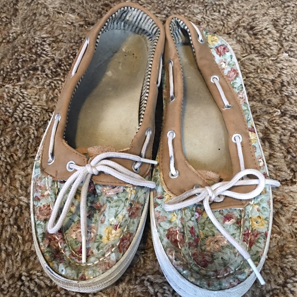 Flower print slip on shoes.