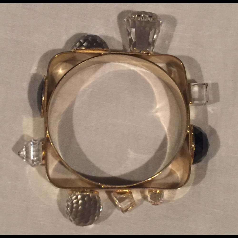 Gold tone metal bracelet with crystals.