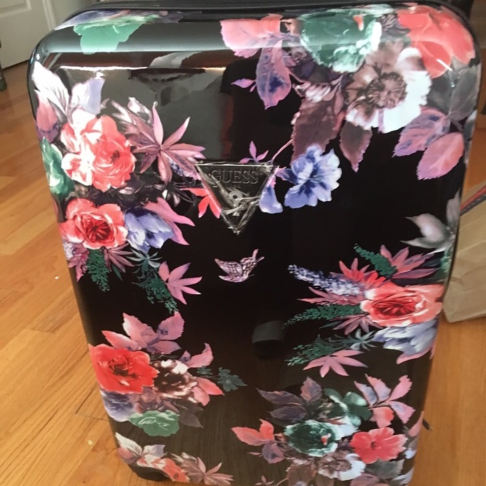 Brand new check in, rolling GUESS luggage