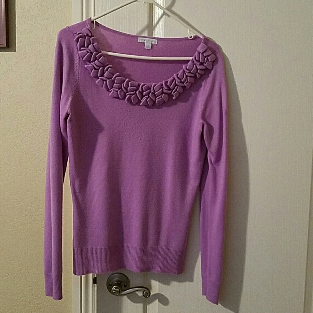 Sweater with front collar detail.