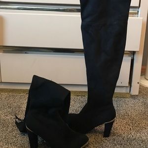 Knee high heeled boots