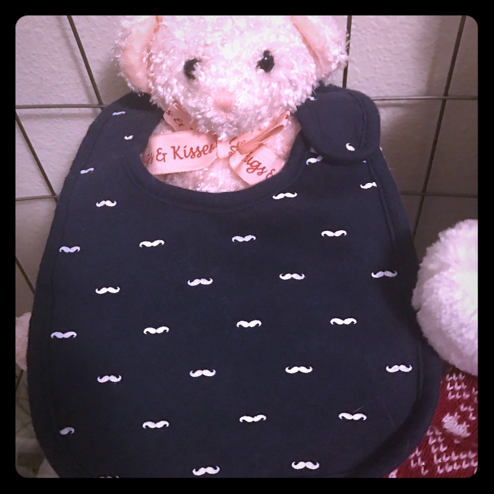Baby's bib,Darkblue w/White mustaches all over it.