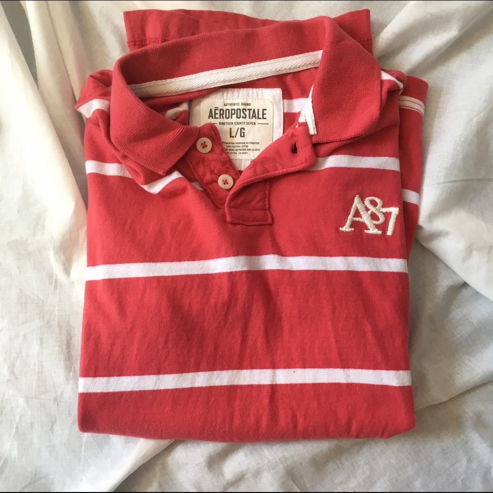 Men's Aeropostale deep salmon collared tee.