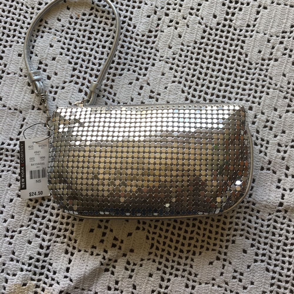 4 1/2" X 8" Silver Shiny Wristlet. New with tags.