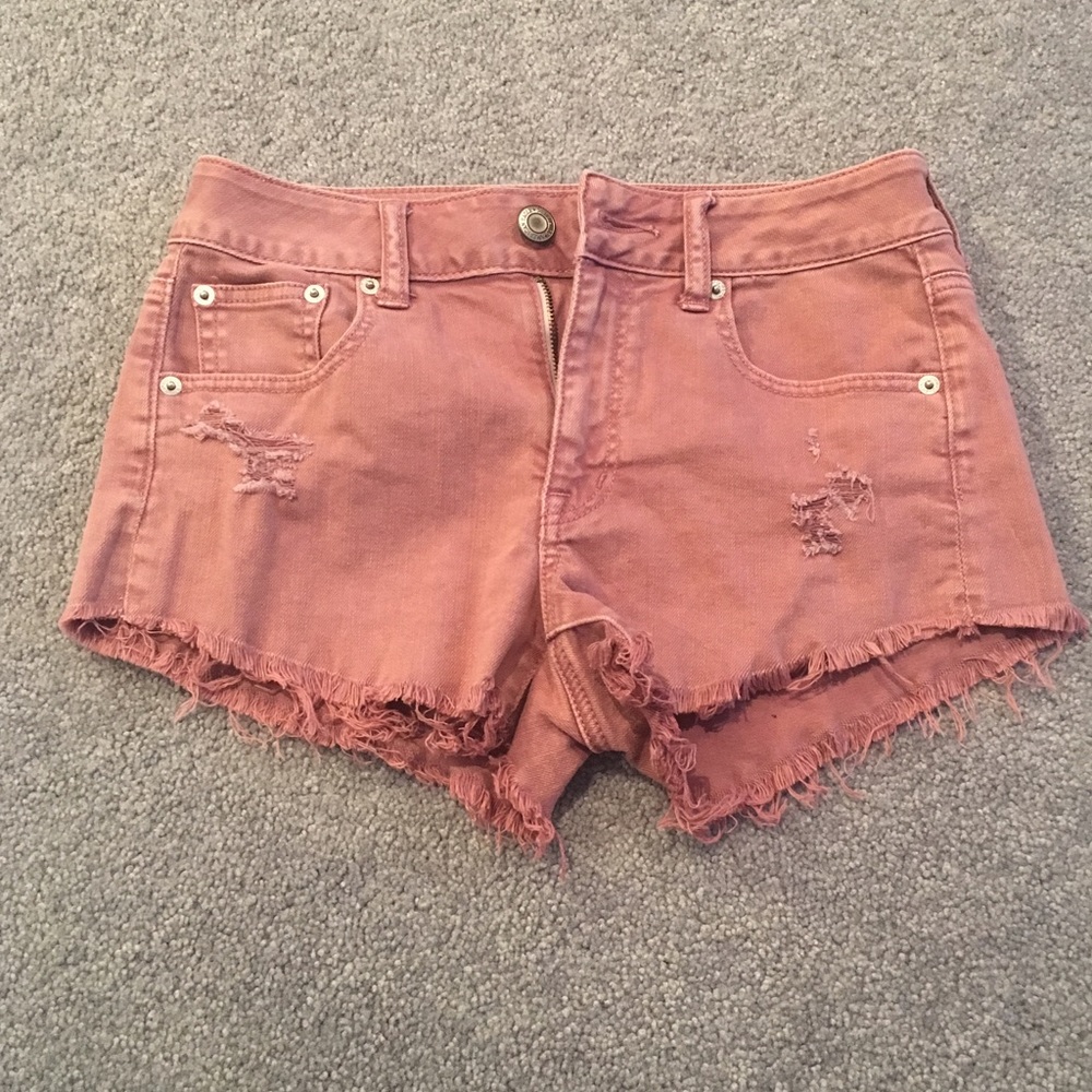 High waisted vintage pink jean shorts.
