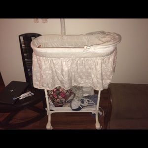 Blue white and gray bassinet with nightlight etc.