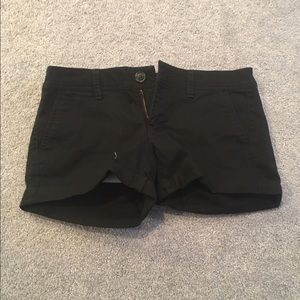 Kaki black shorts.