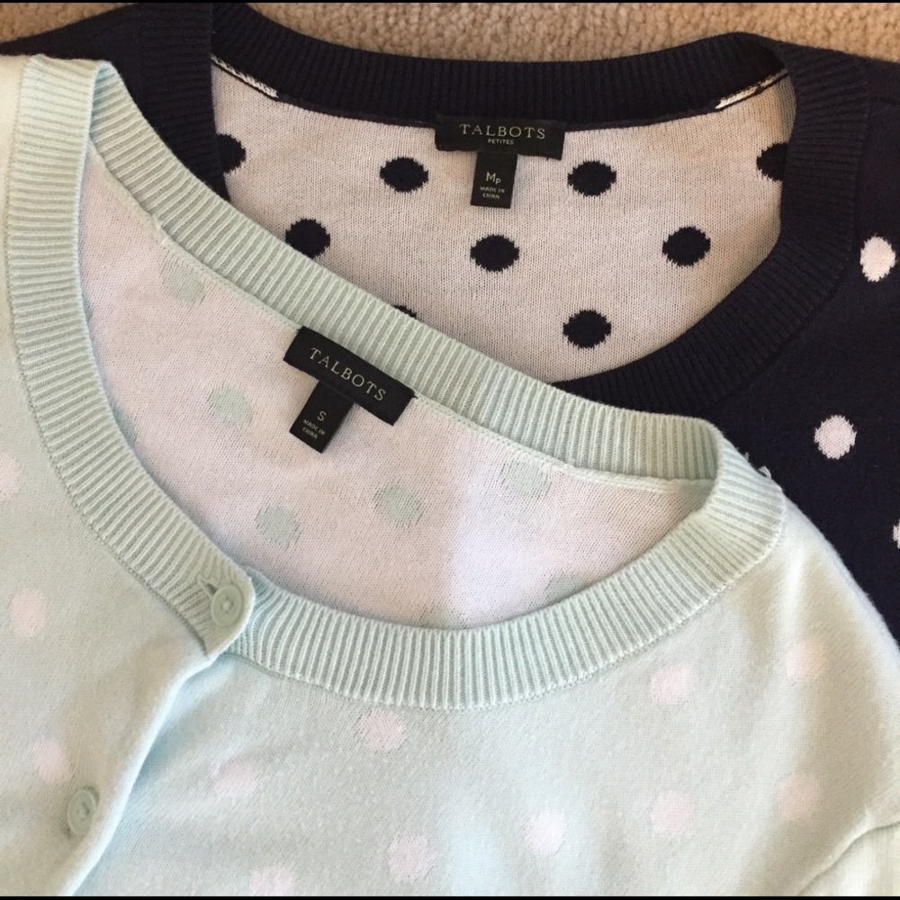 One mint green and one navy polka dotted sweater
