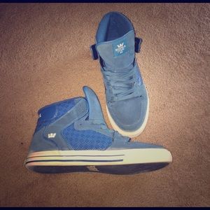 Blue high top Supra shoes
