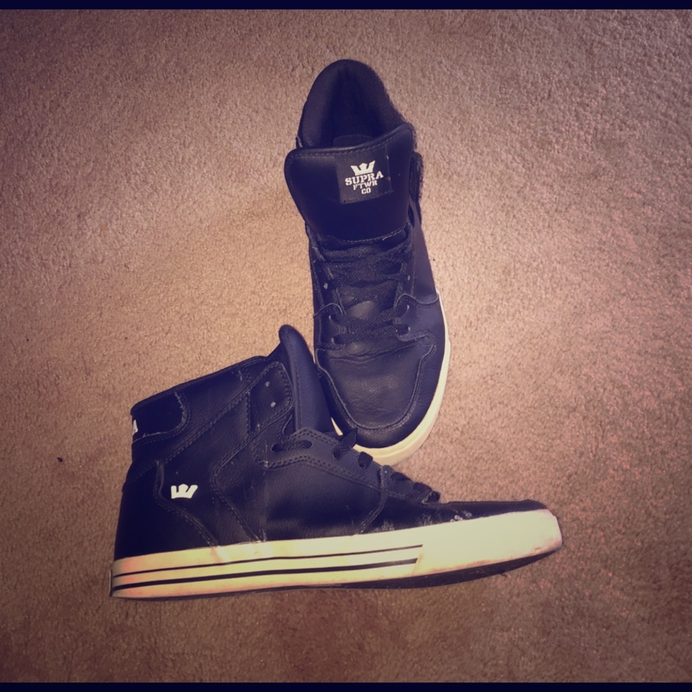 Black pair of high top Supras