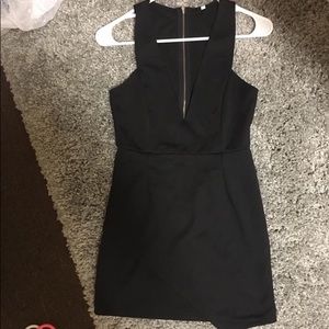 Black mini dress with asymmetrical skirt