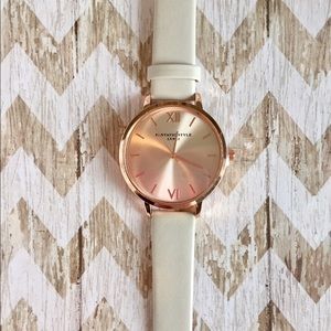 Rose gold watch w/ white band