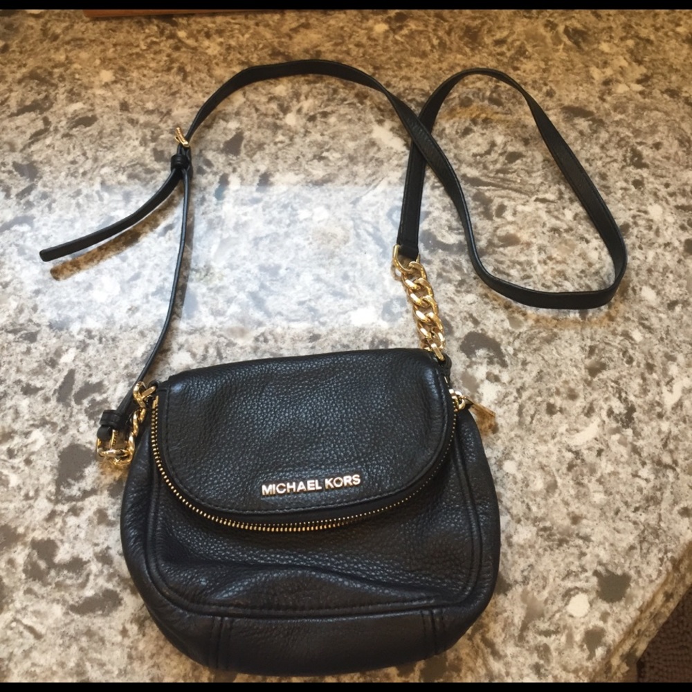 Micheal kors black leather with gold cross body