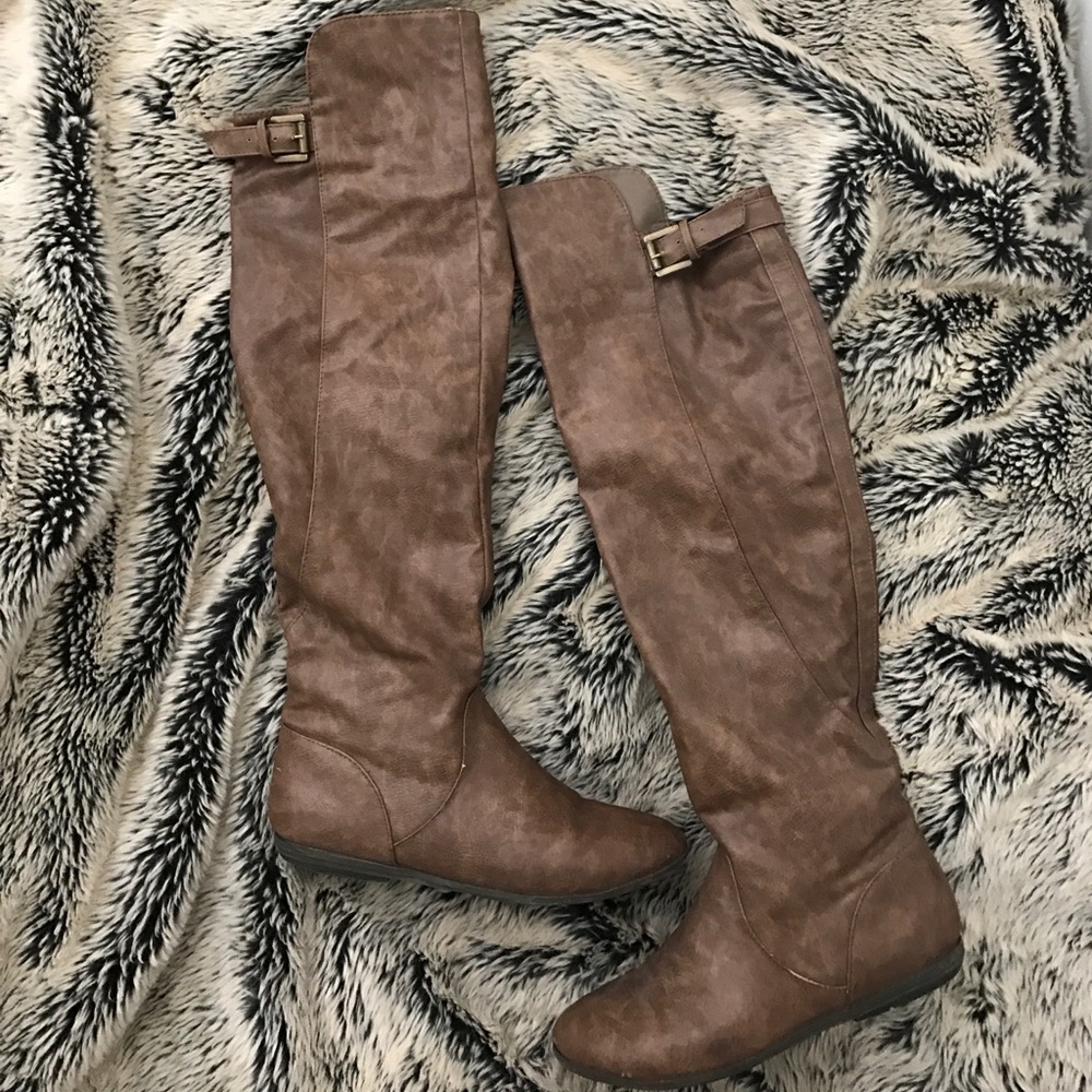 Knee high brown boots.