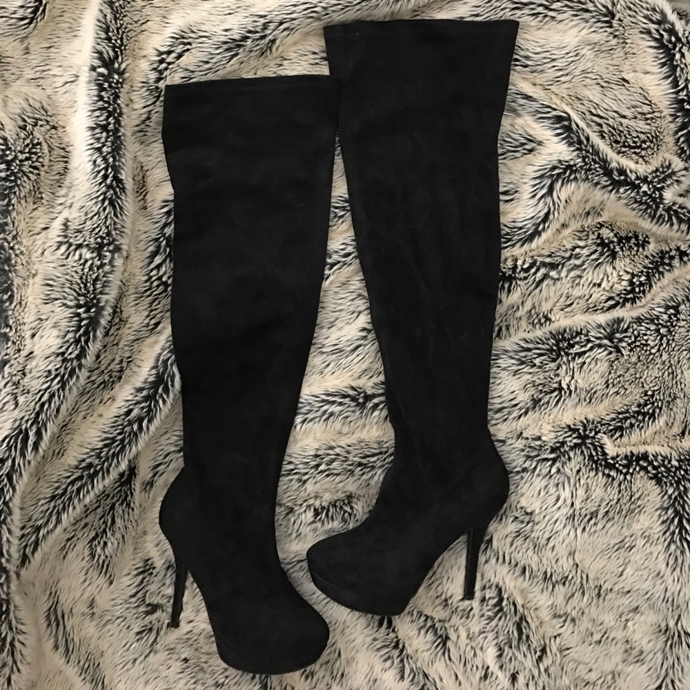 Black over the knee, heeled boots.