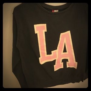 Baby pink LA on dark grey sweater top