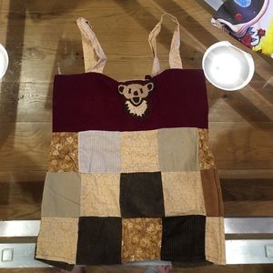 Corduroy patchwork open back tank.