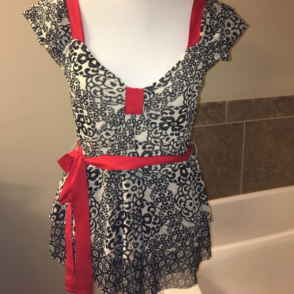 Cute black and white top with red ribbon trim