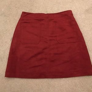 Reddish orange suede skirt
