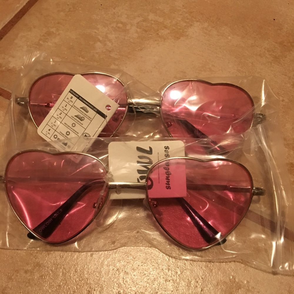 Clear pink lens heart shaped sunglasses.