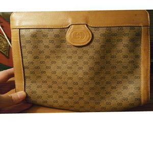 Gucci leather monogram clutch with serial number