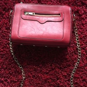 Red and silver leather sling bag