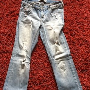 Distressed denim jeans