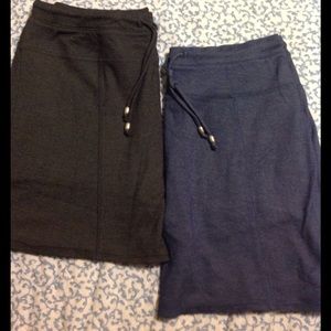 Two athletic skirts with shorts attached.