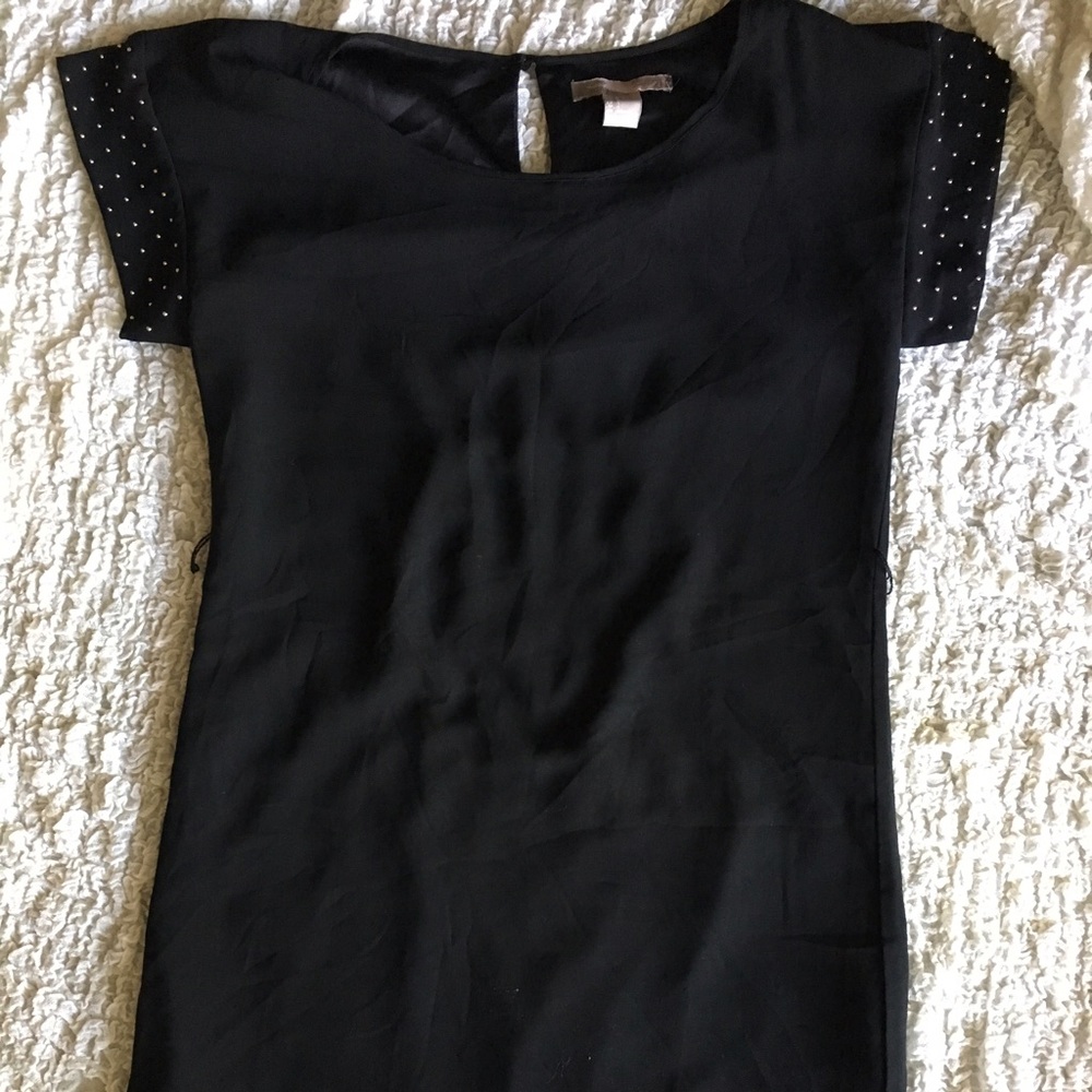 Black with gold stud shaft dress.