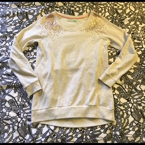 Beige sweater with sequence shoulders