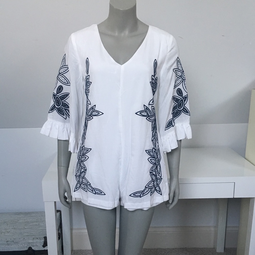 White Romper with navy embroidered detail