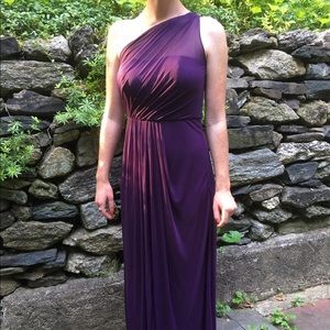 Floor length plum bridesmaids dress.