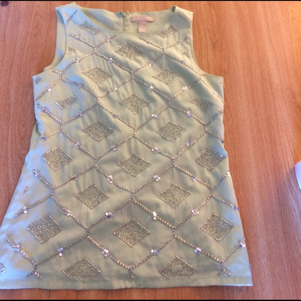 Mint colored sleeveless top with sparkle pattern