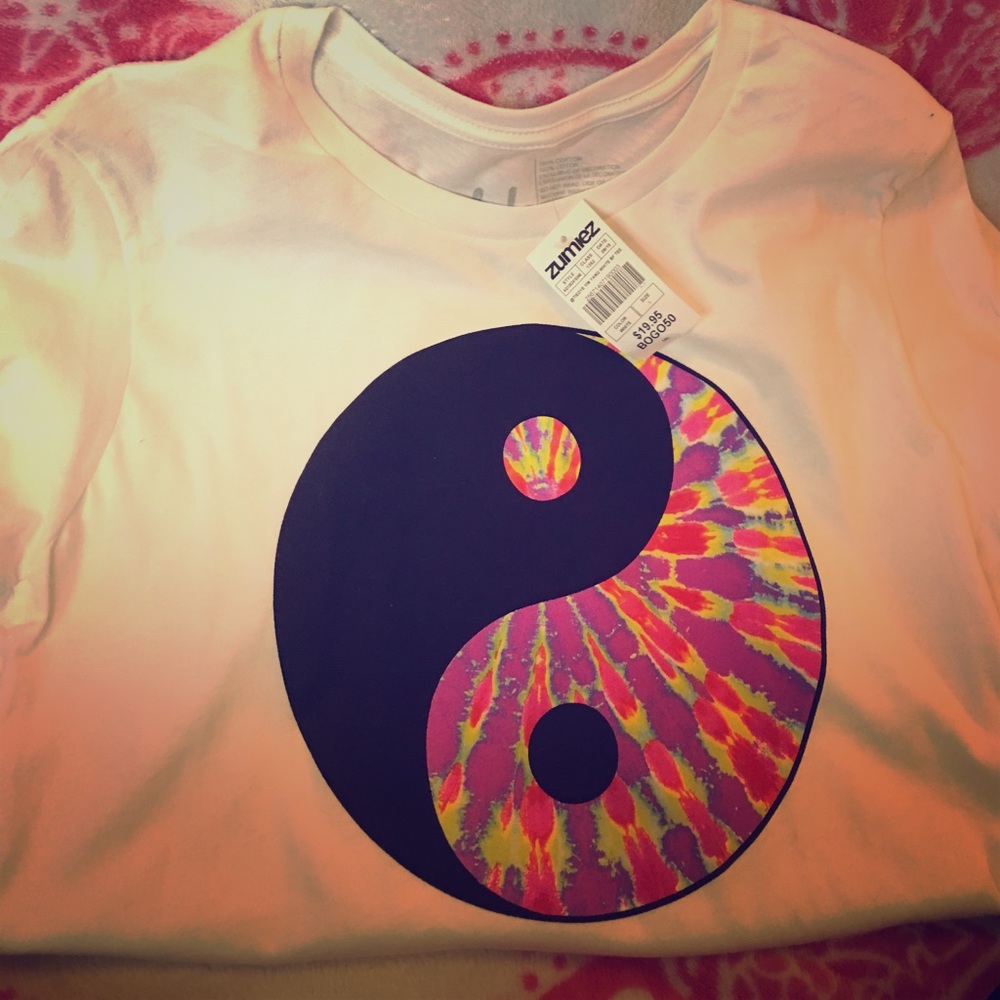 A white shirt with a tie-dye yin and yang symbol