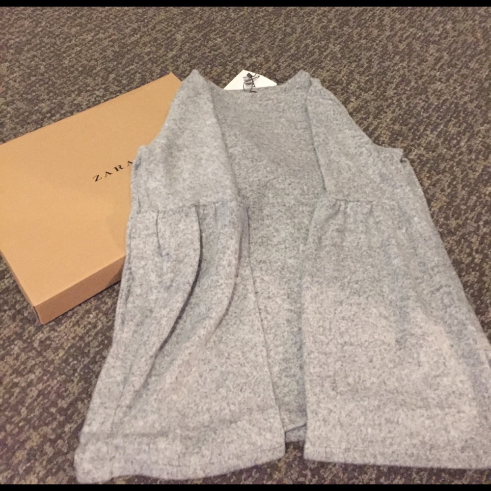 Gray sweater with peplum sleeves