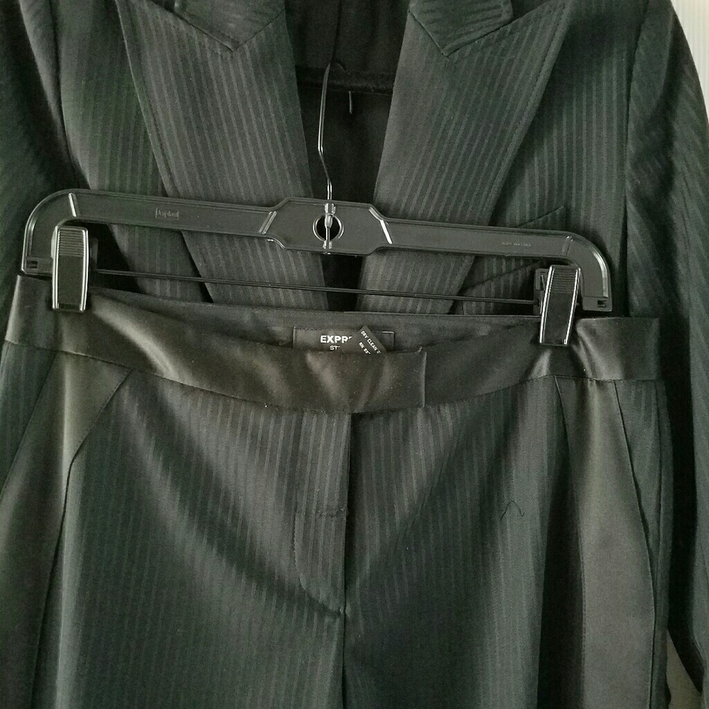 Black on black pinstripe suit