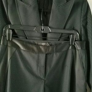 Black on black pinstripe suit