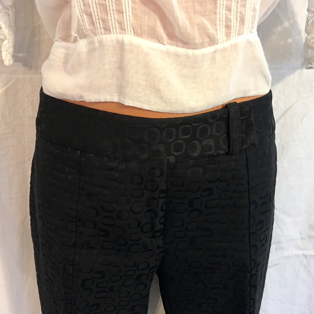 Black straight-leg pants with slight flare