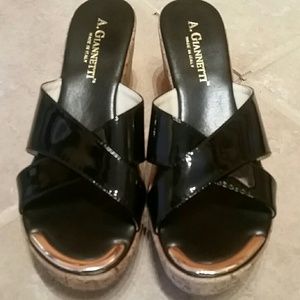 A Giannetti black patent leather wedge sandals